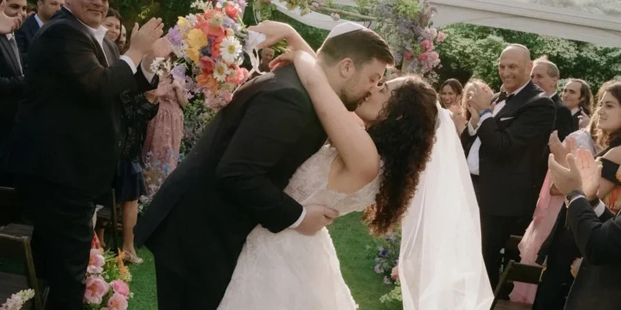 bride-groom-kiss-aisle